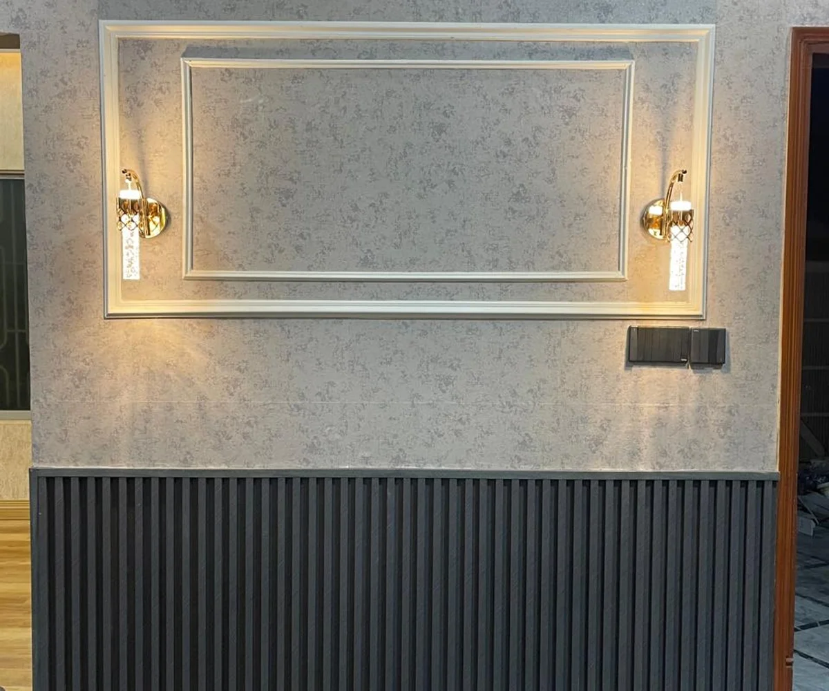 Fluted wall panel design installed in a Karachi living room by Identity Interior