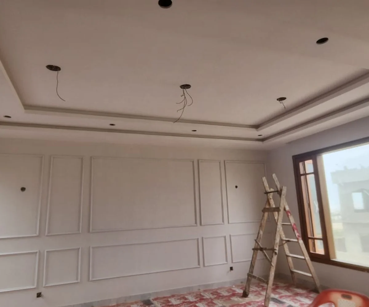 Living room wall moulding design installed by Identity Interior in Karachi