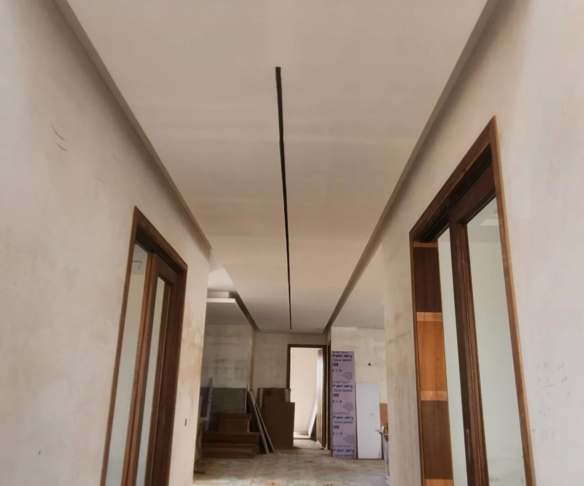 Modern false ceiling design with cove lighting installed in Karachi by Identity Interior