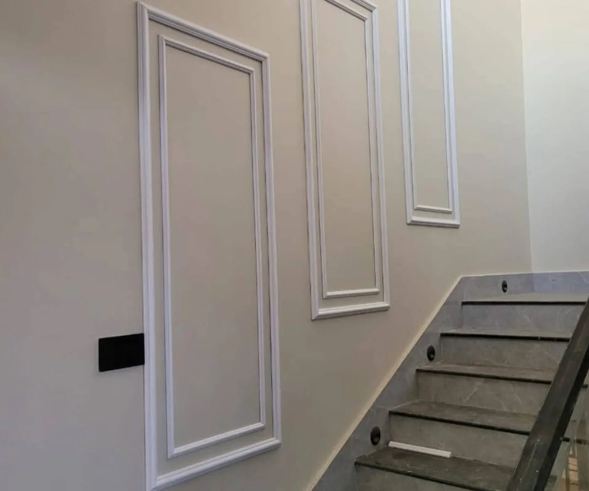 Staircase wall panel design installed in a Karachi home by Identity Interior