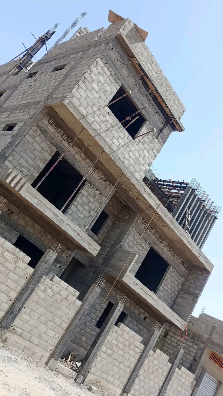 Grey structure of a new house under construction in Karachi