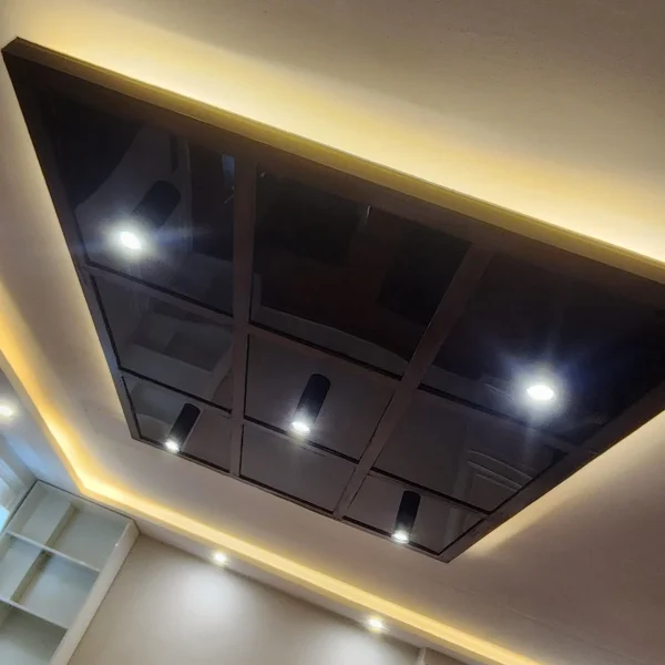 Modern false ceiling design with cove and recessed lighting at Custom House Karachi by Identity Interior